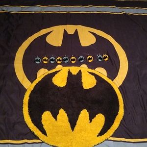 Batman bathroom: shower hooks, shower curtain, and a Batman rug